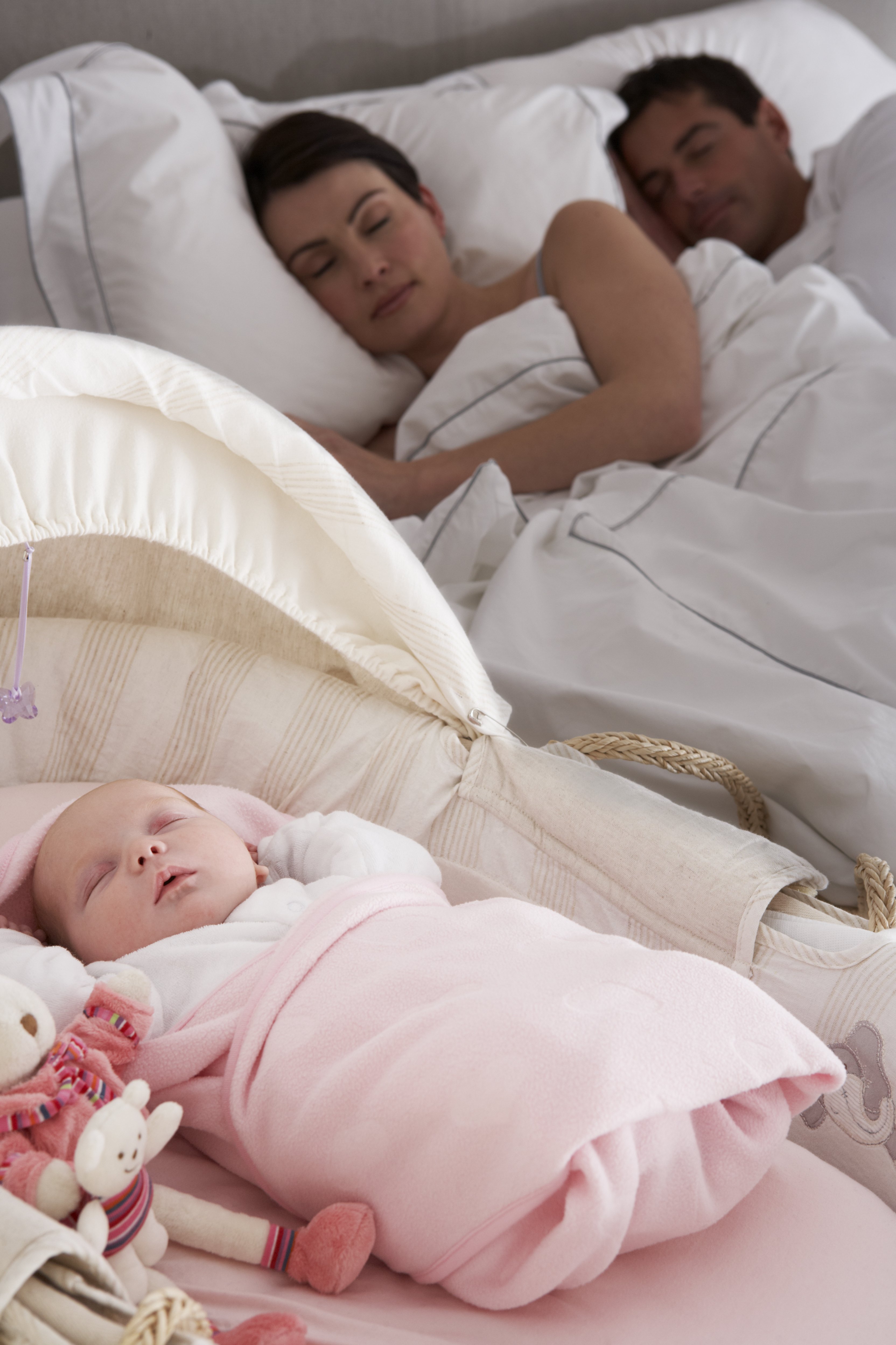 Newborn Baby Sleeping in Cot in Parents Bedroom